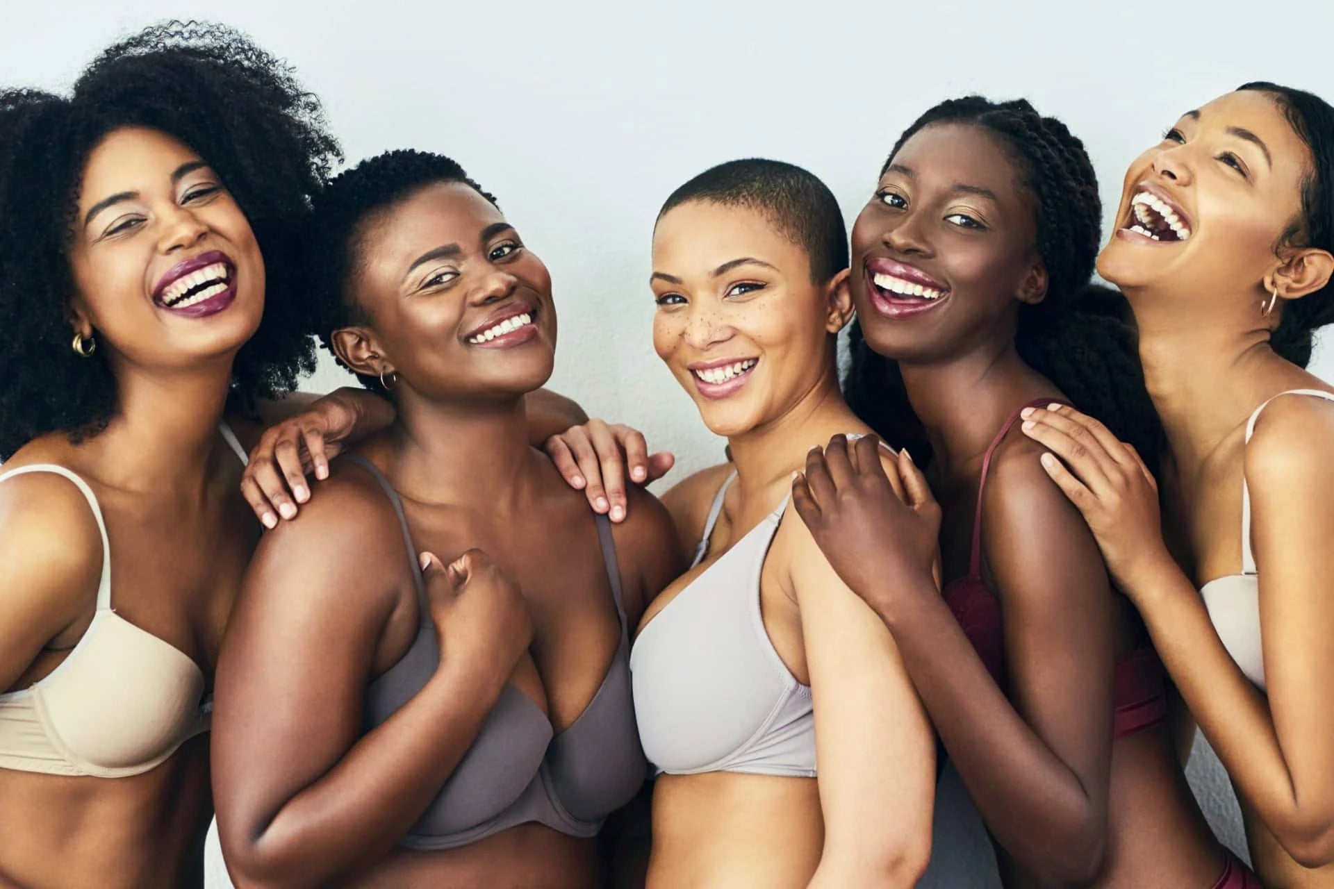 Women in underwear smiling