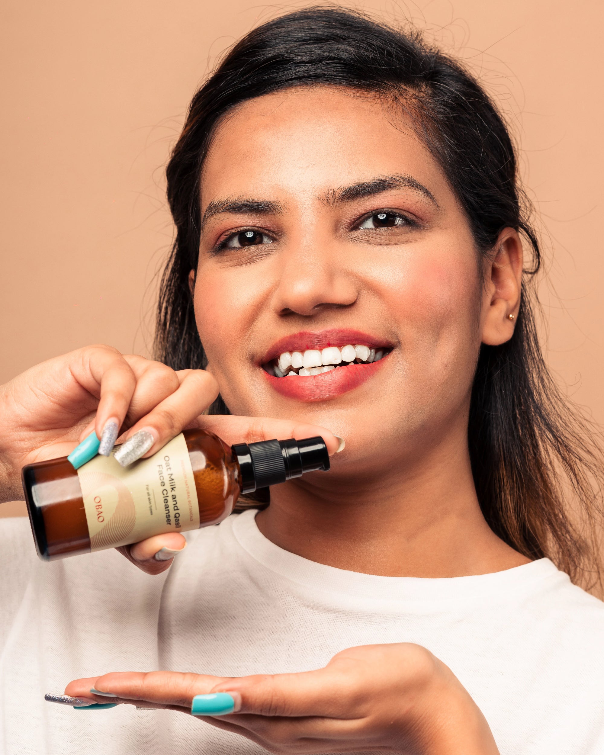 Woman using Oat Milk & Qasil Cleanser