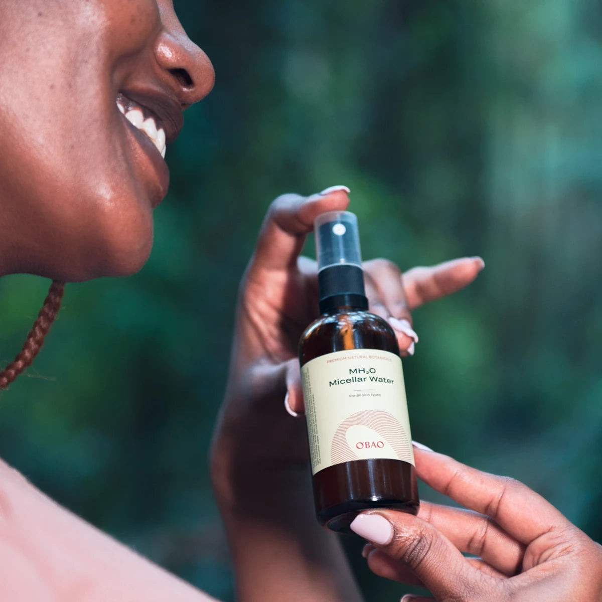 Woman presenting OBAO Micellar Face Cleanser