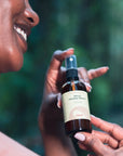 Woman presenting OBAO Micellar Face Cleanser