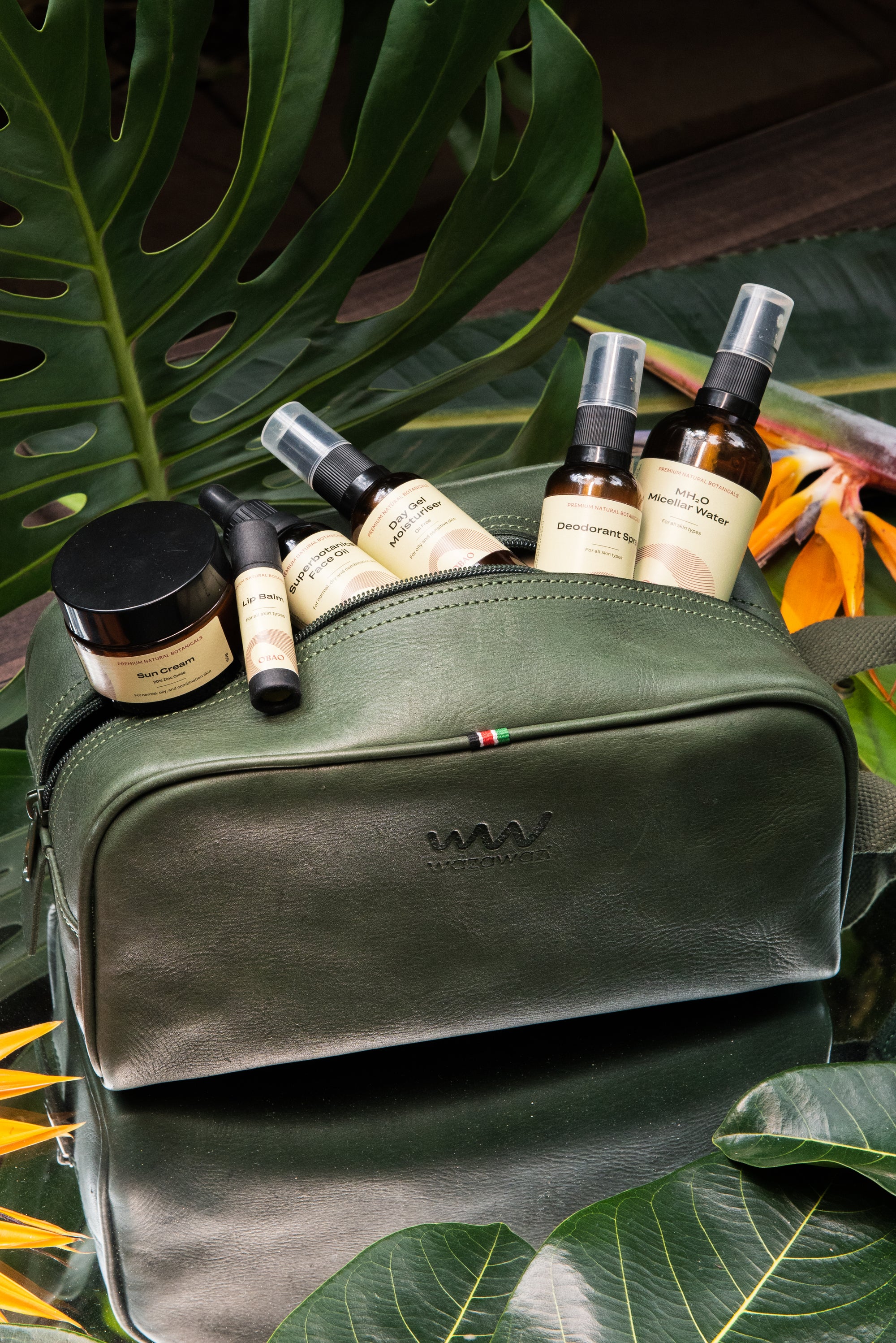 OBAO Products in a green bag including Moisturiser, Face Cleanser and Lip Balm
